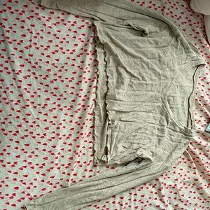 tan and white cropped V-neck sweaters